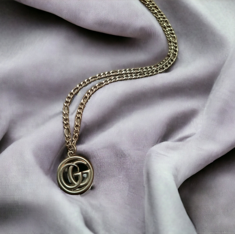 Pendant on a stainless steel chain-